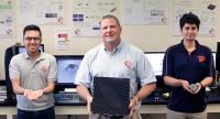 Raymond C. Rumpf, Ph.D., Stands with Two of his Graduate Research Assistants