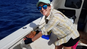 Claire Rosemond measuring a red hind