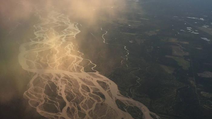 The Yukon River's braided appearance is caused by coarse-grained sediment from glaciers further upstream.