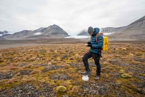 Senior author Dr James Bradley (right) measuring greenhouse gas   fluxes from the tundra soils in Svalbard, during summer.