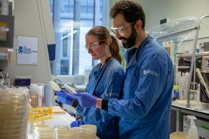 Researchers Dr Franklin Nobrega and Rachel Buchanan looking through samples in the phage collection.