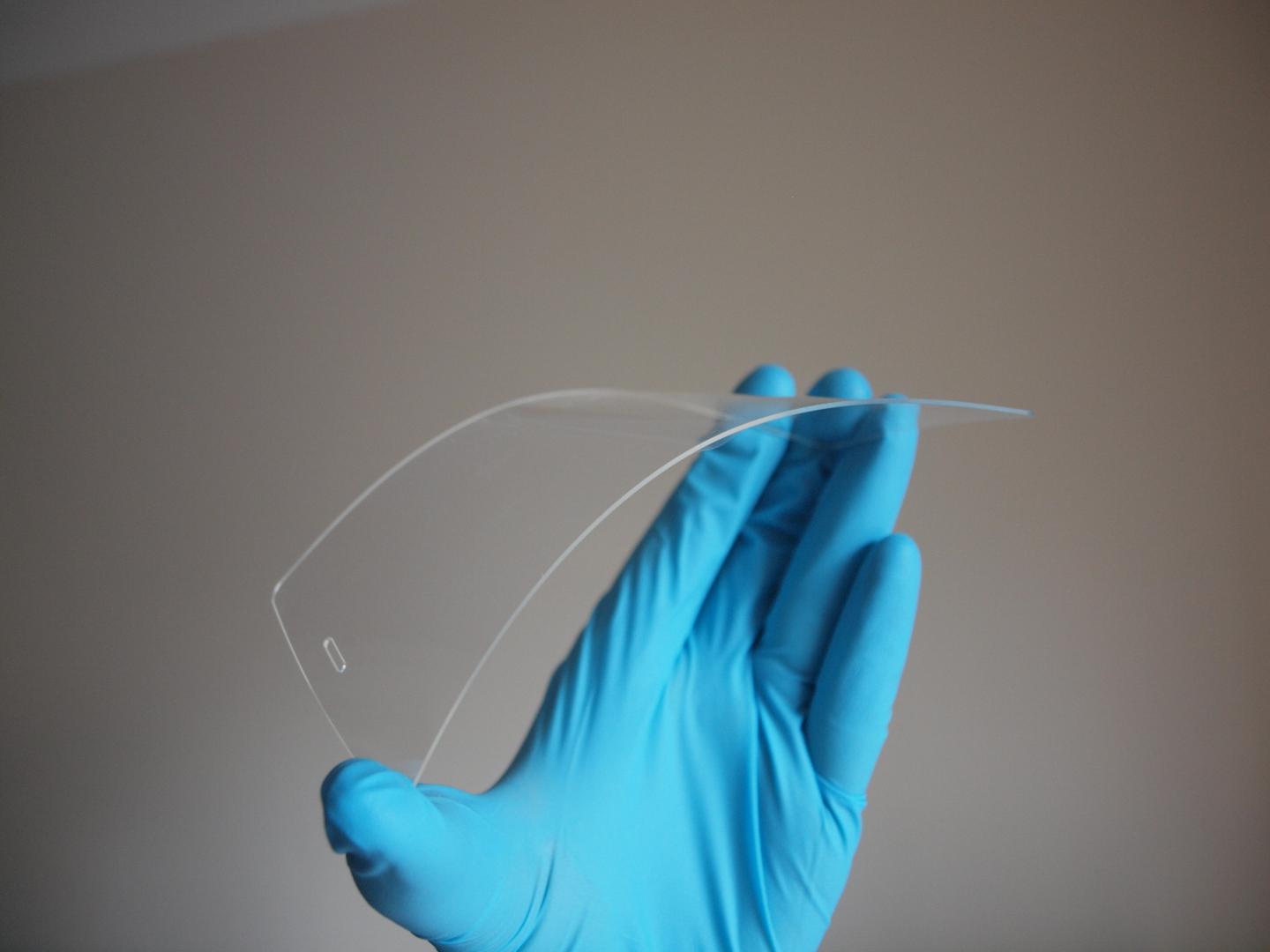 Dr Matthew Large Flexes a Screen Made from Acrylic Plastic Coated in Silver Nanowires and Graphene
