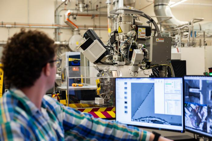 Mauseth at the consol of the unshielded FIB-SEM preparing a sample for analysis.