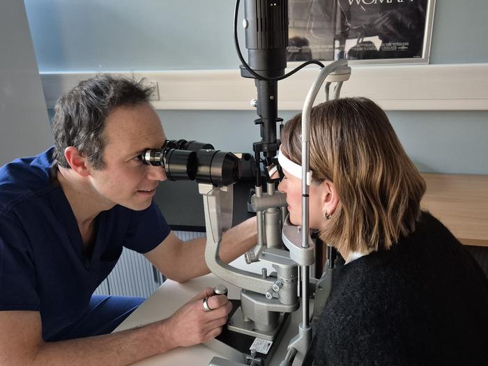Ophthalmologist examining patient