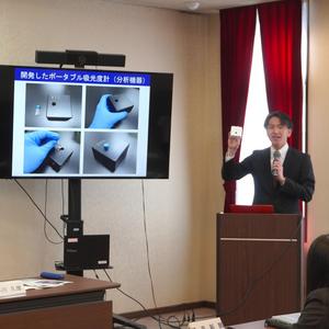 Associate Professor Yuta Nakashima Demonstrating the "POTA" Device