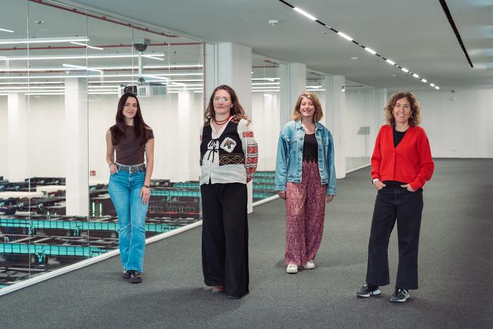 Researchers in front of MareNostrum 5 supercomputer in Barcelona
