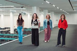 Researchers in front of MareNostrum 5 supercomputer in Barcelona