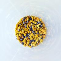 Different colours of grains in a round dish