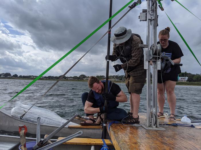 Research group samples sediment core